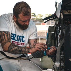 Mark wearing our BSMC XR T Shirt - Off White working on his bike