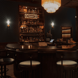 Dimmly lit Tommy's Bar and seating